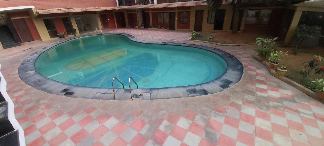 Suvarna Regency Hassan Esterno foto
